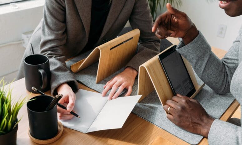 A woman discussing counter offers in real estate with an agent.