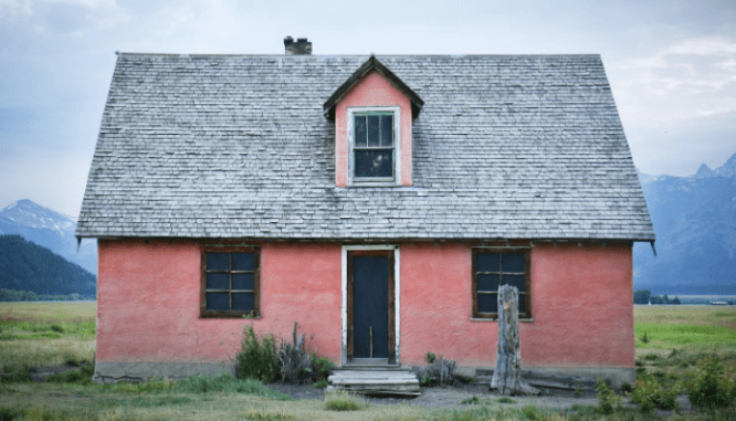 A photo of a house represents the topic of buying a bank owned home.