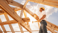 A builder looking at a house to determine if it's cheaper to build a house or buy a house.