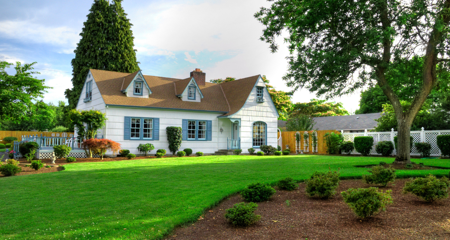 White siding house that is for sale by owner.